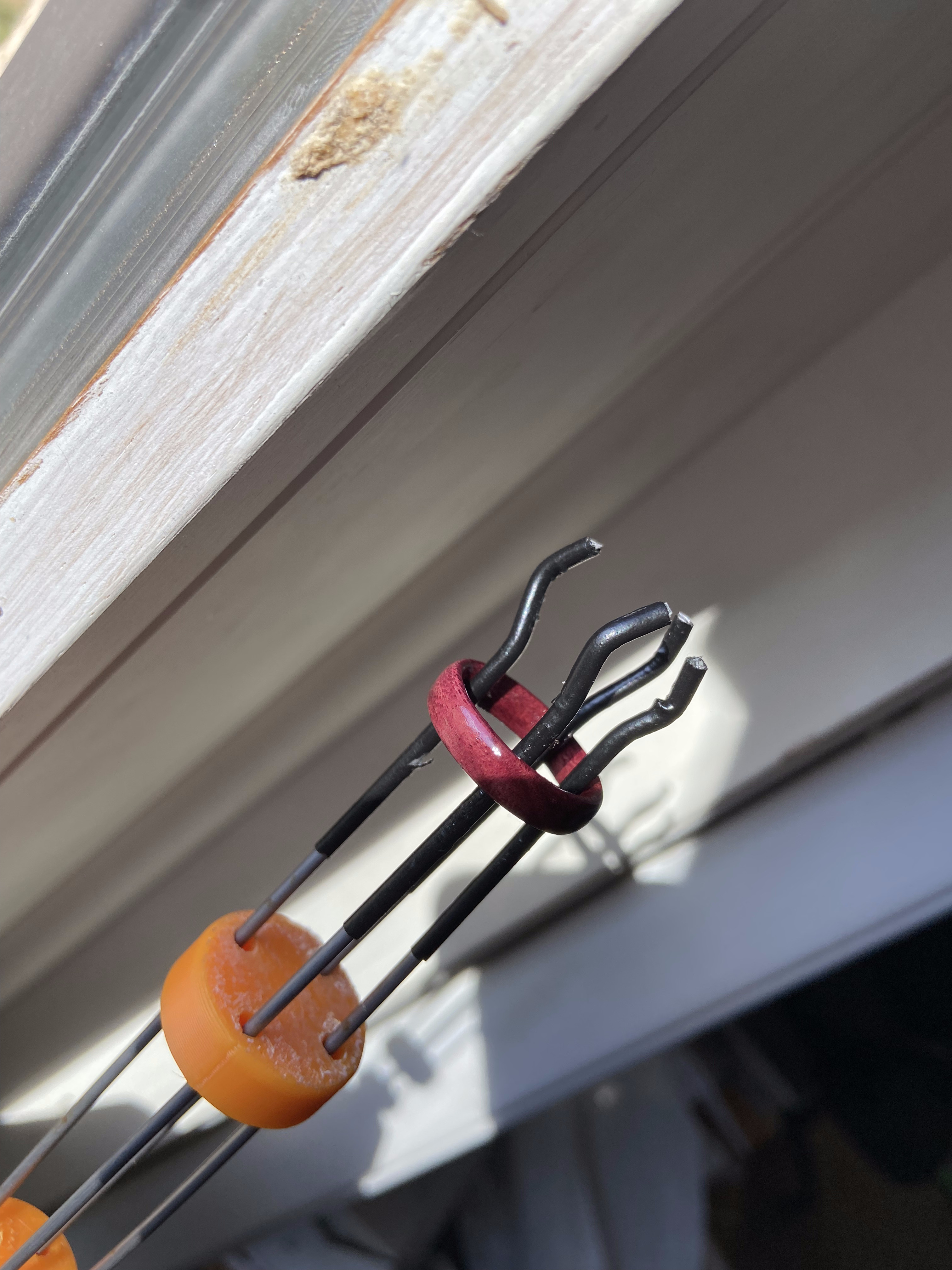 Ring held in a wire prong setting jig during shaping